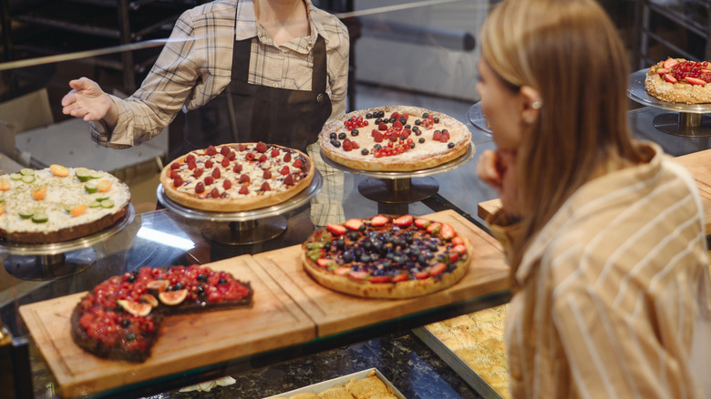 person shopping for pies