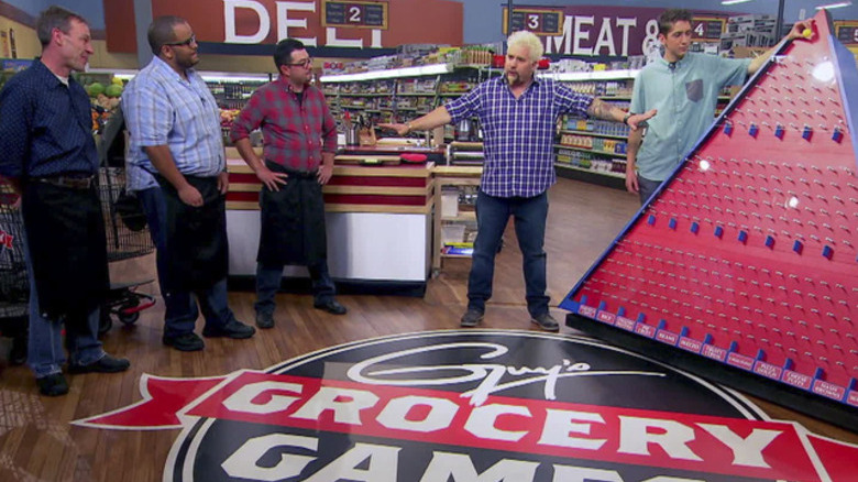 The Guy's Grocery Games logo on the floor of the supermarket set from the show