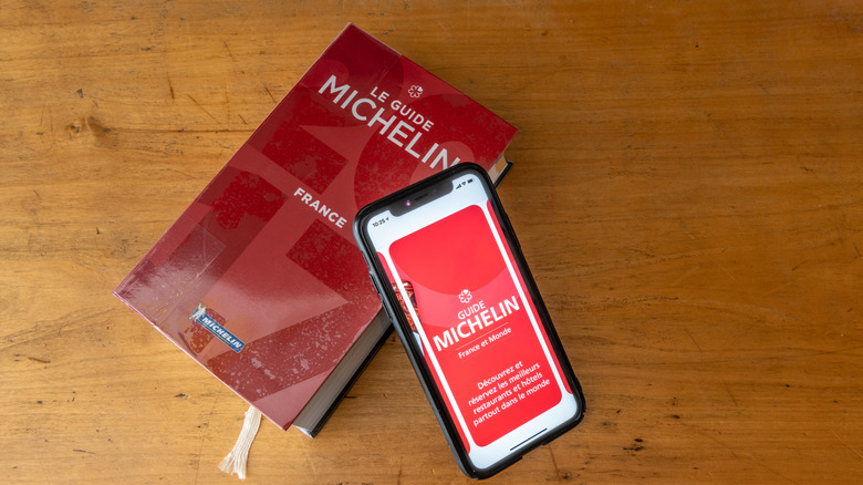 Michelin guide book and phone with app