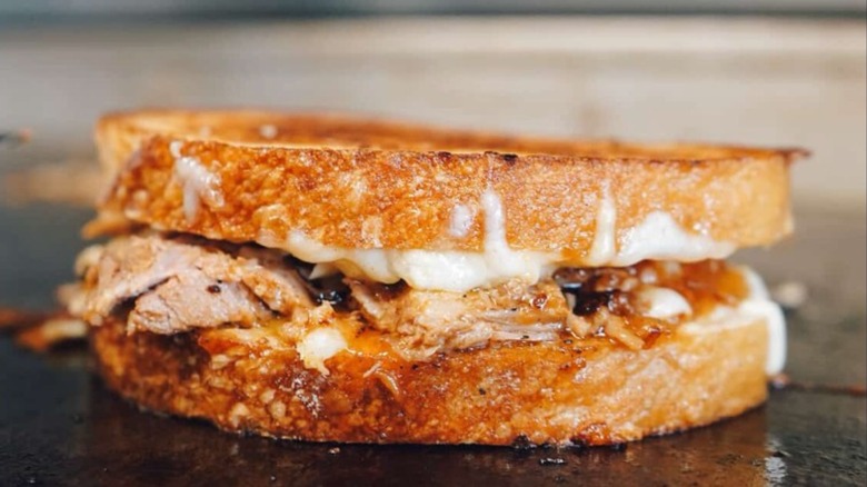 Hog grilled cheese filled with BBQ pulled pork and caramelized onions