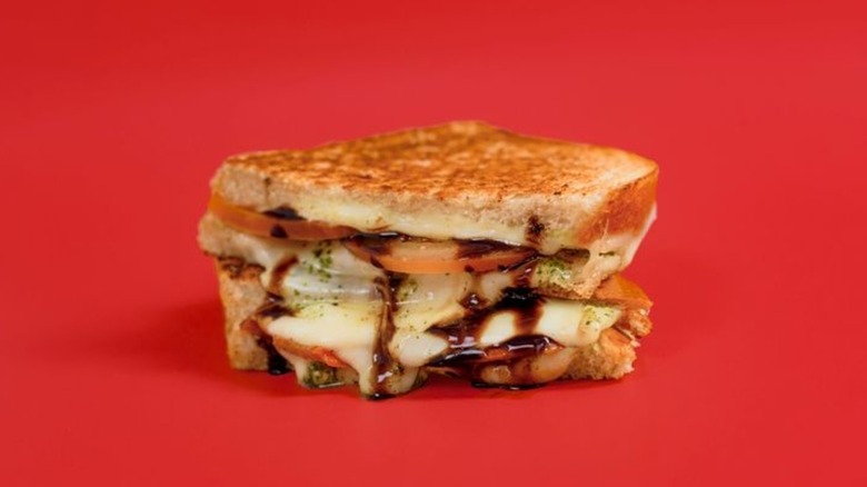 The Godmother grilled cheese with tomatoes, pesto, and balsamic glaze