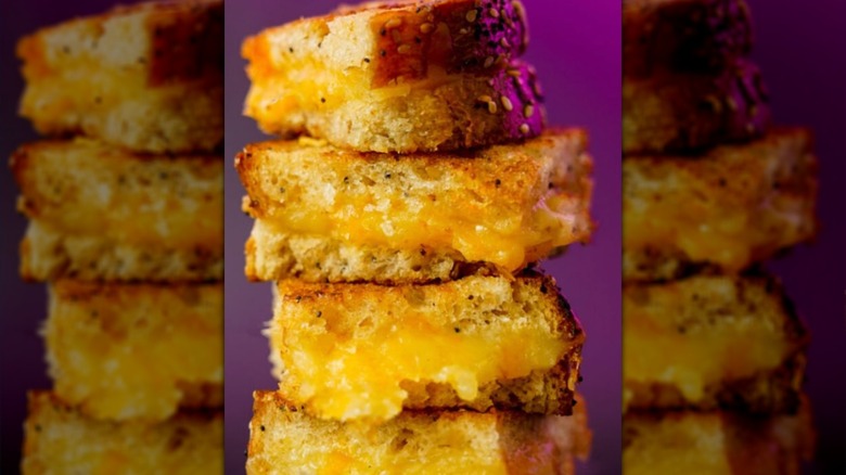 Grilled cheese cut into four segments on top of each other in a pile