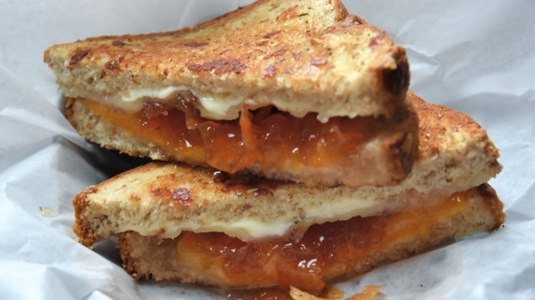 Grilled cheese with goat cheese and quince jam, sliced in half