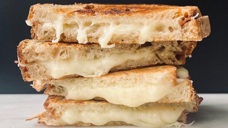 Four pieces of grilled cheese stacked atop one another