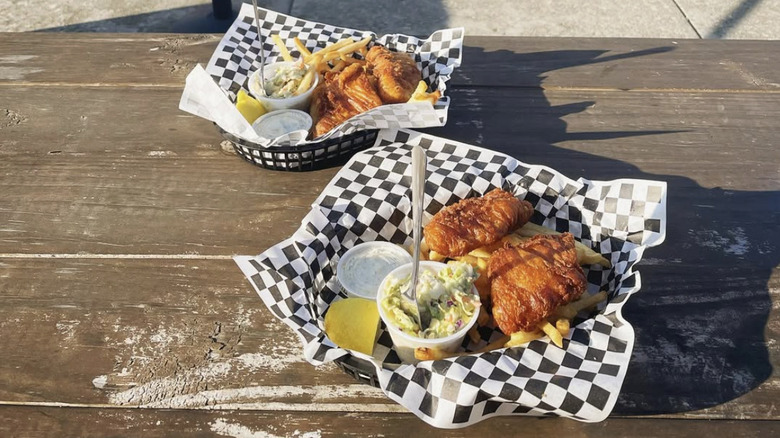 Fish and chips with slaw on checkered paper