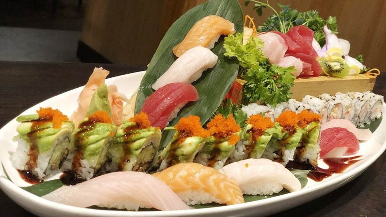 Assorted sushi, sashimi, and nigiri on one plate