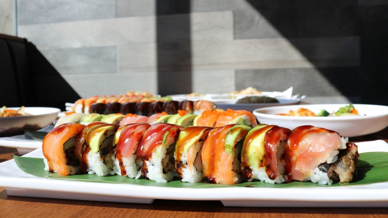 Sushi rolls against a sunny background