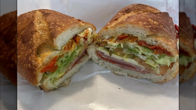 Two halves of an Italian sub on paper