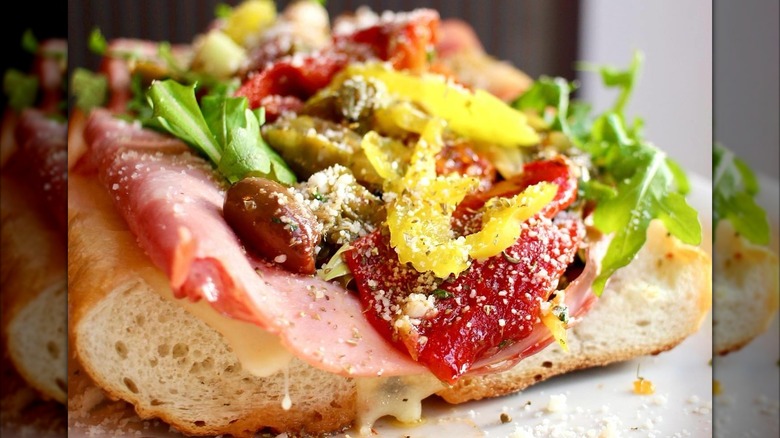 Open-faced Italian sub with olives and peppers