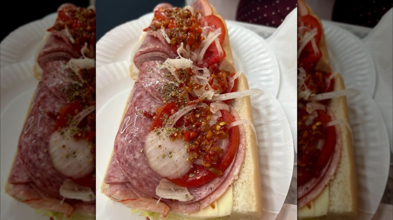 Open Italian subs on several paper plates