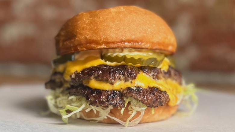 Double cheeseburger with pickles