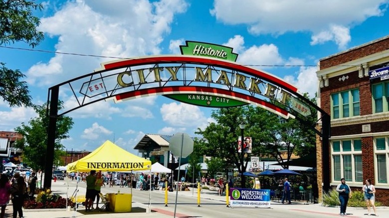 City Market archway stretching over farmers market tents lining street