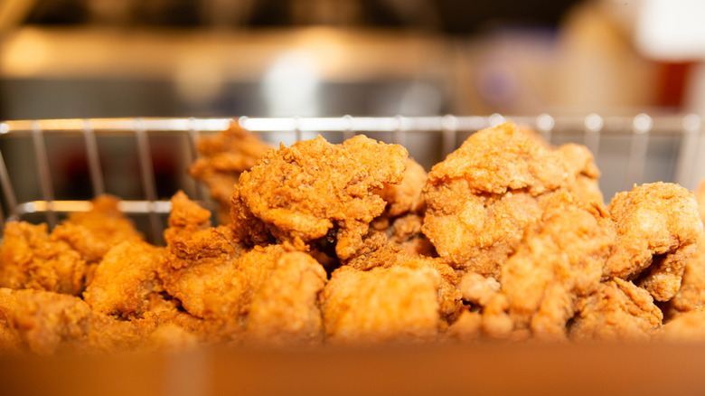 Close-up of fried chicken in fry basket