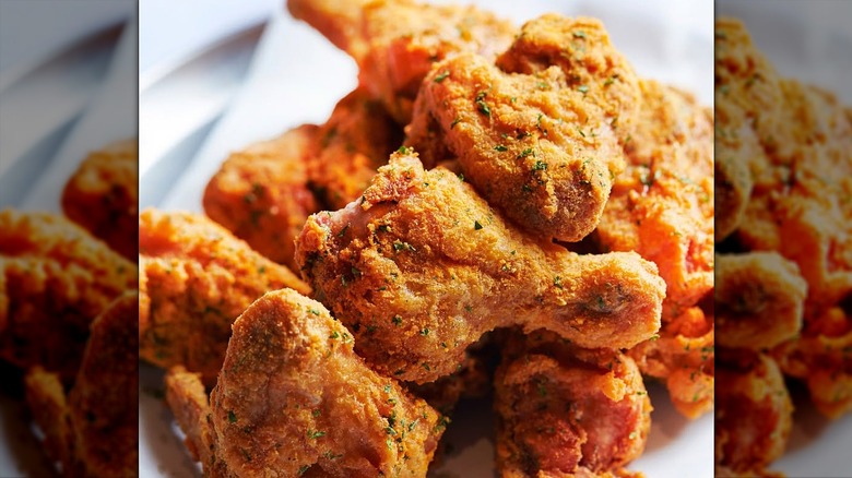 Close-up of herbed fried chicken legs