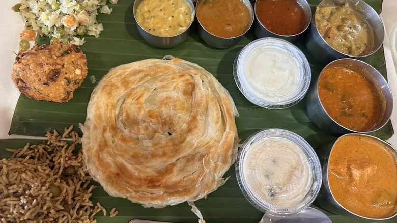 Vegetarian thali laid out on banana leaf