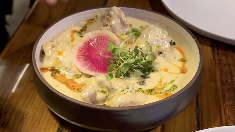 Indian curry with radish in a grey bowl