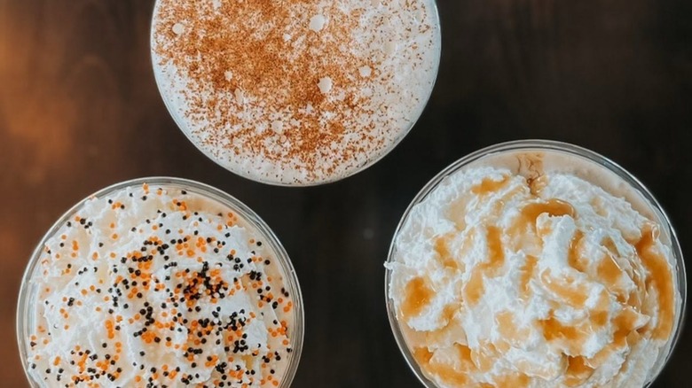 Overhead shot of three autumnal drinks from Meg-A-Latte