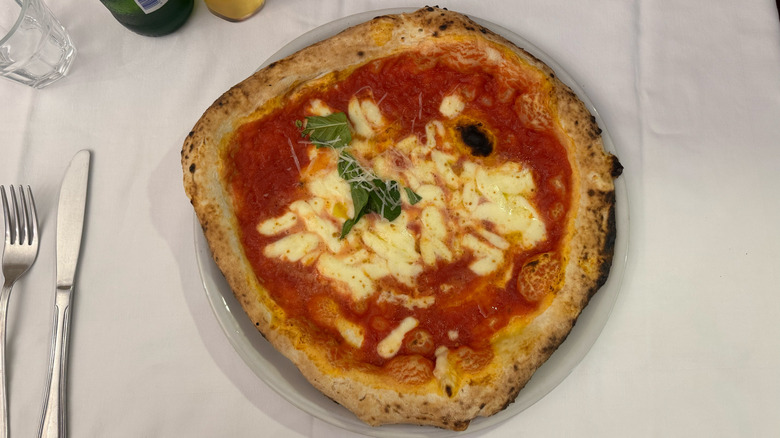 Margherita pizza from Pizzeria Port'Alba in Naples, Italy on white table cloth