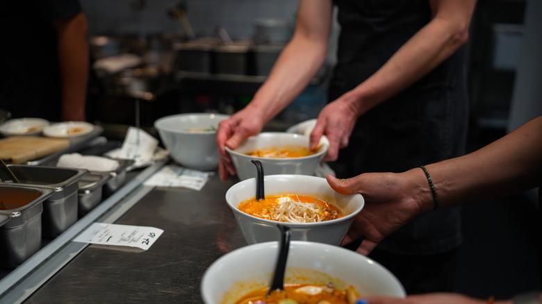 Ramen bowls being assembled