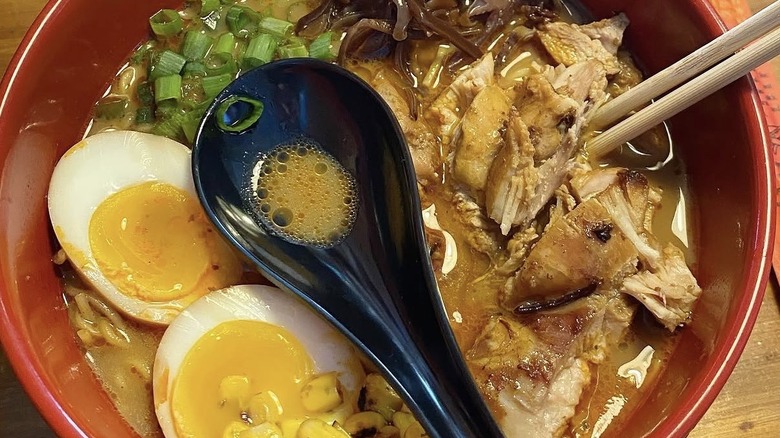Chili ramen with tonkotsu broth, wood ear mushrooms, soft-boiled egg, charred corn, pork char siu