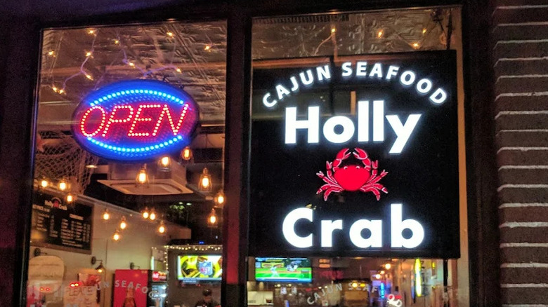 Holly Crab lit up sign at restaurant