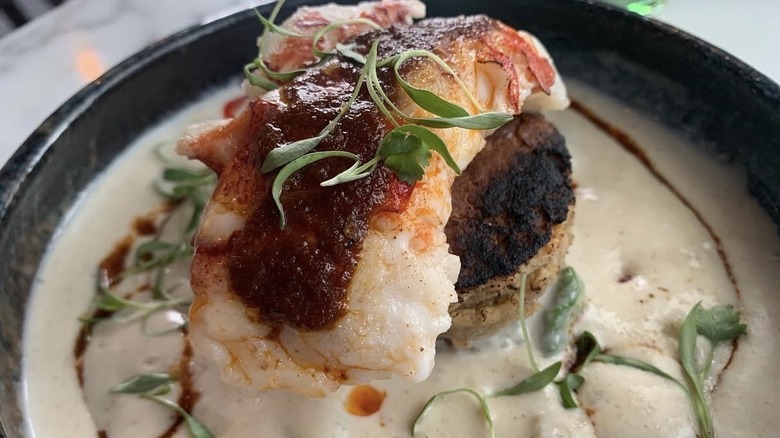 Lobster escabeche atop plantain cornbread and creamy corn puree