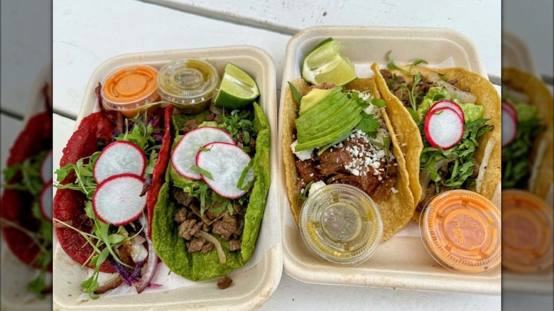 Two sets of tacos with radishes and salsa