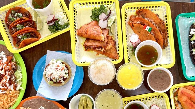 A delicious spread of tacos on yellow trays