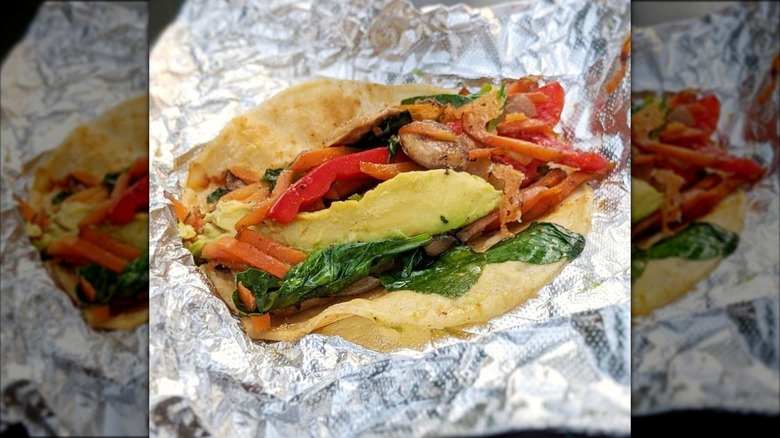 La Reyna taco with vegetables on tin foil