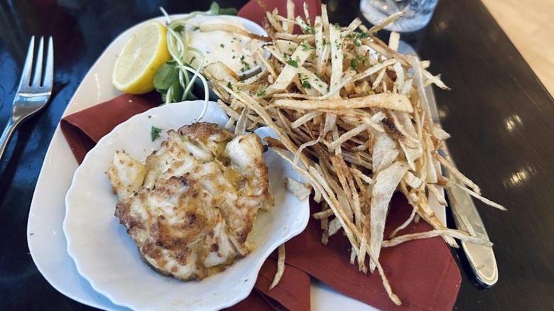 Crab cake with shoestring fries and lemon