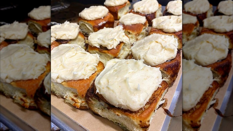 One dozen fluffy, frosted cinnamon rolls