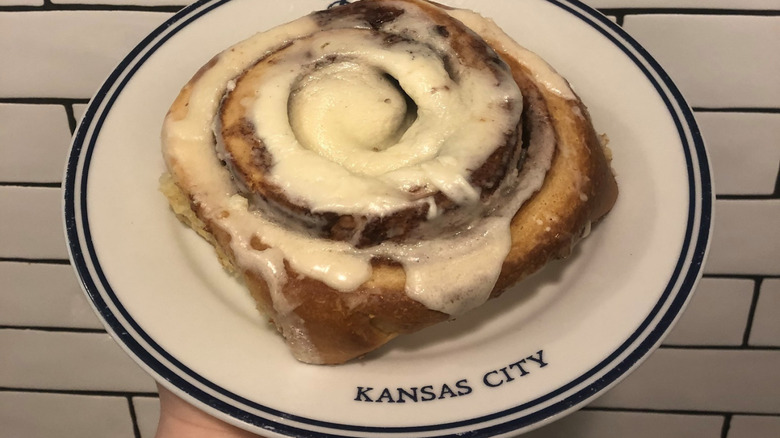 Cinnamon roll on plate emblazoned with Rye