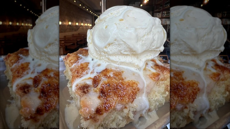 Cinnamon roll topped with vanilla ice cream