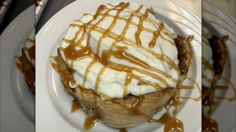 Caramel apple cinnamon roll on plate