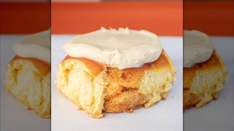 Close up of single frosted cinnamon roll