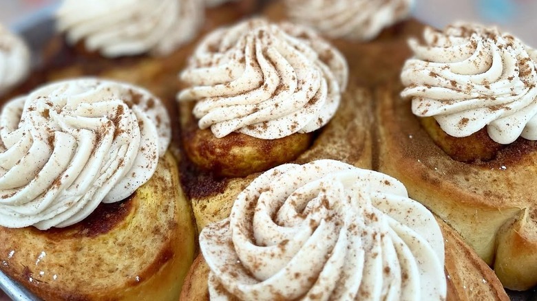 Tray of frosted pumpkin spice cinnamon rolls