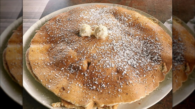 Giant pancake on white plate at Henhouse Cafe