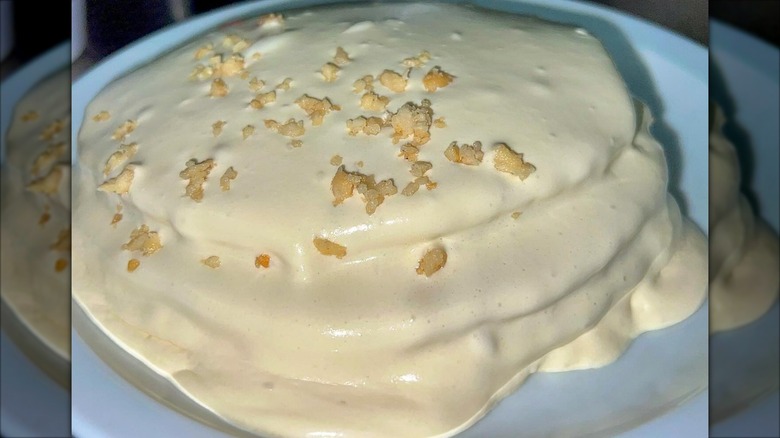 Macadamia nut pancakes on white plate at Boots & Kimo's