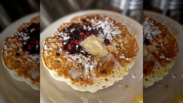 Raspberry chocolate pancake on white plate