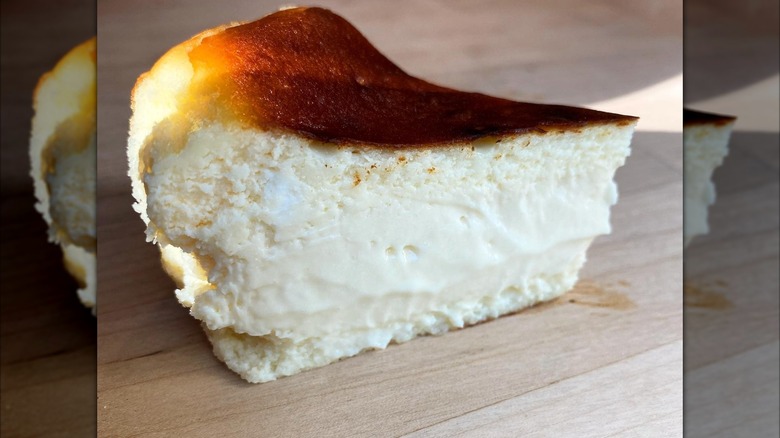 Close-up of Basque cheesecake on wooden counter