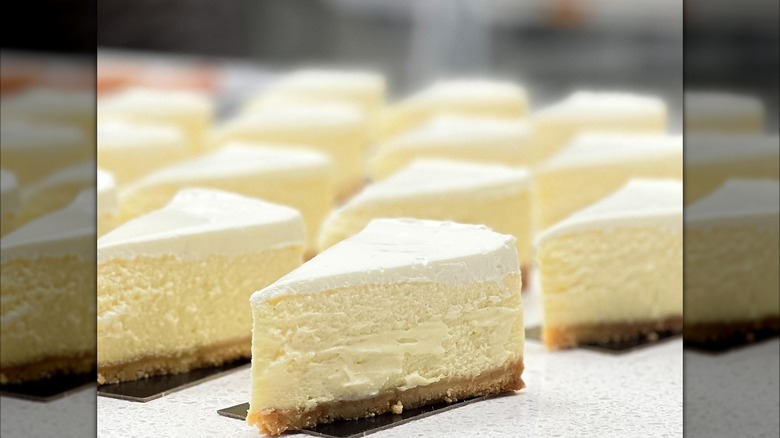 Slices of cheesecake on white counter