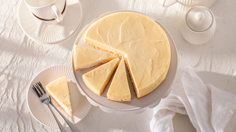 Top-down shot of New York cheesecake on white table