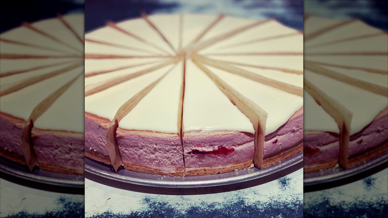 Cheesecake slices with pink exterior divided by paper