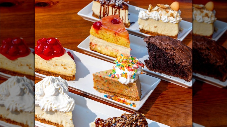 Various cheesecake slices on white platters