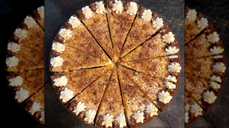 Top-down view of whole sliced salted caramel cheesecake