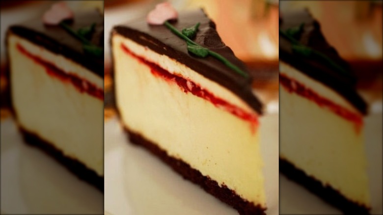 Close-up of chocolate topped cheesecake slice