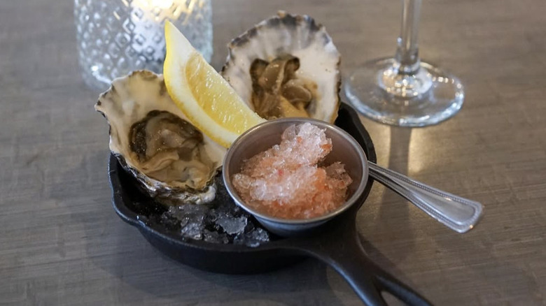 Two oysters with a lemon and granita