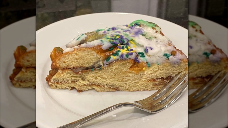 Slice of king cake on plate with fork
