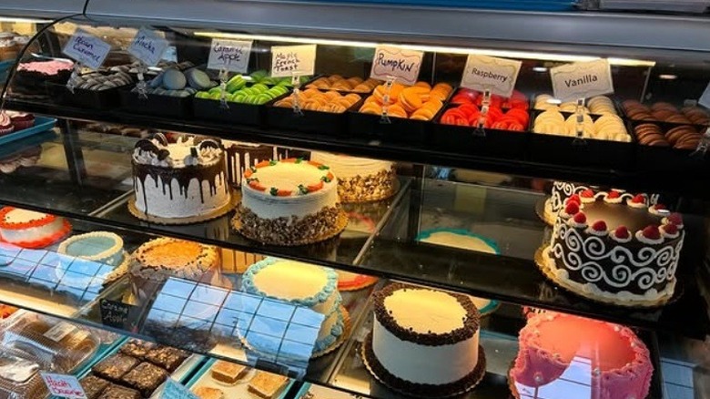 Cakes in glass case at Huron Mountain Bakery