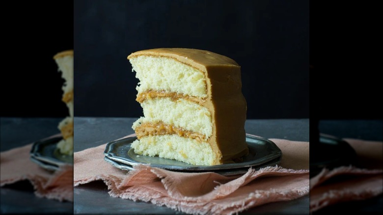 Three layered white cake with caramel frosting